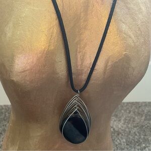 BEAUTIFUL BLACK ONYX NECKLACE WRAPPED IN SILVER CASING. BLACK LEATHER NECKLACE.